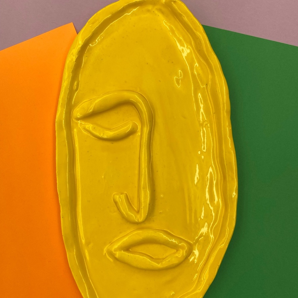 Clay flat face, original artist made. Yellow